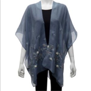 Vest blue sheer with embroidered daises.